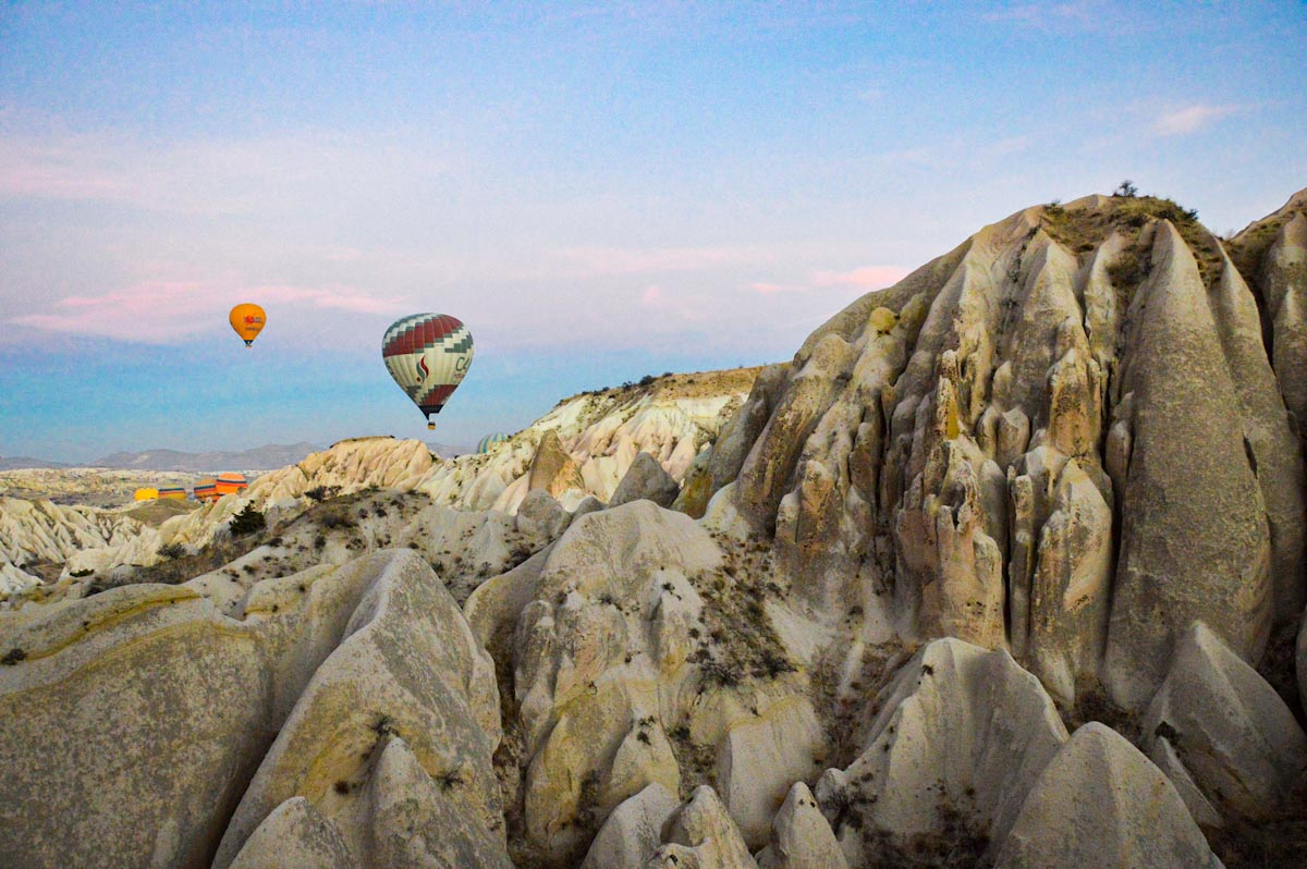 Hot air balloon in Cappadocian landscape